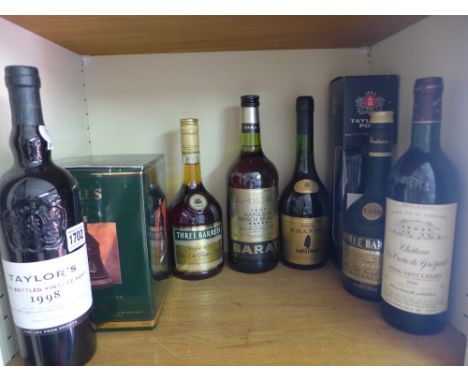 Two bottles of Taylor's bottled Vintage Port 1998 and 2003, four bottles of assorted Brandy, a Bells 1992 Christmas decanter 