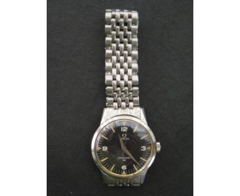 An Omega Seamaster 30 stainless steel bracelet watch with black dial and centre sweep 37mm wide including winder - engraved t