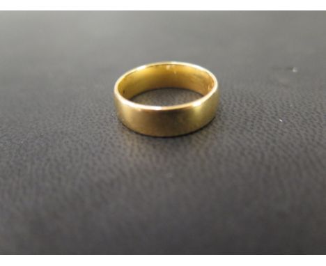 A 22ct gold band ring - Hallmarked London - Ring size L 1/2 - Weight approx 7.1gms
Condition Report: Good - With light surfac