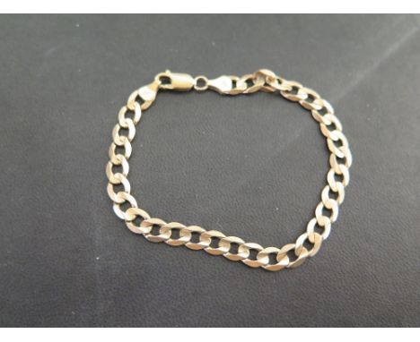 A 9ct gold curb-link bracelet - Hallmarked Birmingham - Length 21.5cms - Weight approx 10.5gms
Condition Report: Good - With 