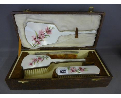 A boxed silver and enamel four piece brush set by Penlington and Batty