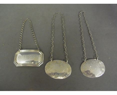 Three silver decanter labels