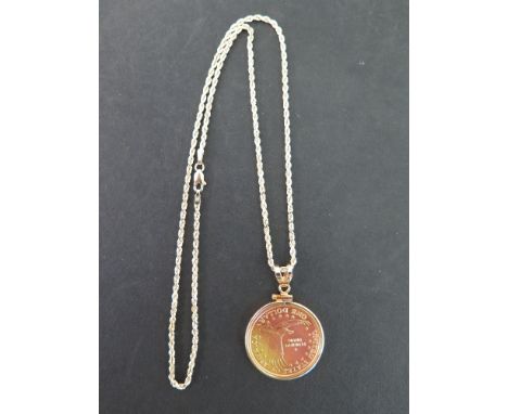 A rope-twist chain - Stamped 14K - Length 47cms - Weight approx 7.2gms - Suspending a 2003, Sacagawea dollar coin pendant - D