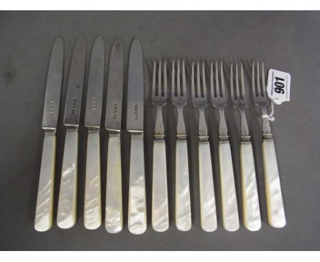 A set of six silver and mother of pearl dessert forks and five matching knives - Hallmarked Sheffield 1933 - 34 - maker R J M
