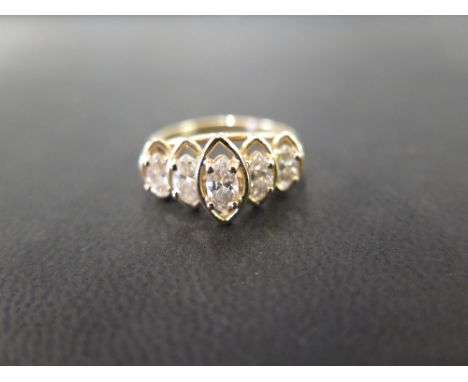 A five-stone diamond ring - The marquise-shape diamonds within an openwork setting to the plain band - Estimated total diamon