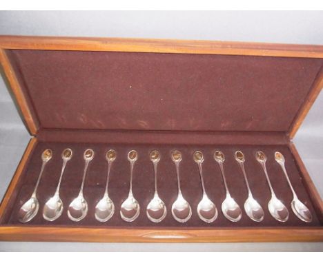 A set of twelve silver R S P B spoons in a wooden case - Total silver weight approx. 10 troy oz.
