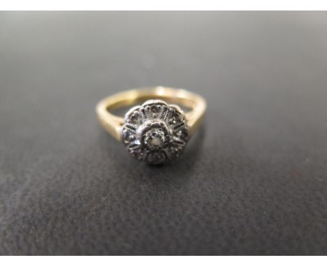 An 18ct gold diamond floral cluster ring - Hallmarked London - Ring size K 1/2 - Weight approx 3.8gms
Condition Report: Good 