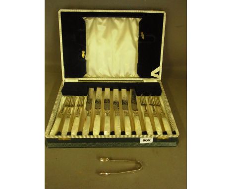 A set of six mother of pearl handled knives and forks and a silver sugar nip in an associated  box