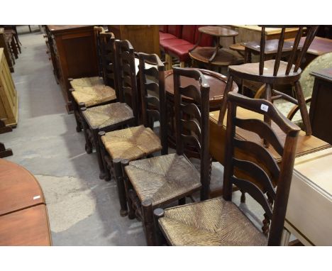 A matched set of six 18th/19th Century ash ladder back kitchen chairsEach chair with a ladder back above an envelope rush sea