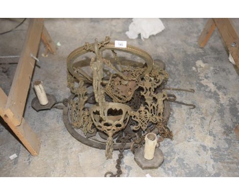 An antique iron hanging light fitting and a french gilt metal hanging ceiling light fitting. (2) 