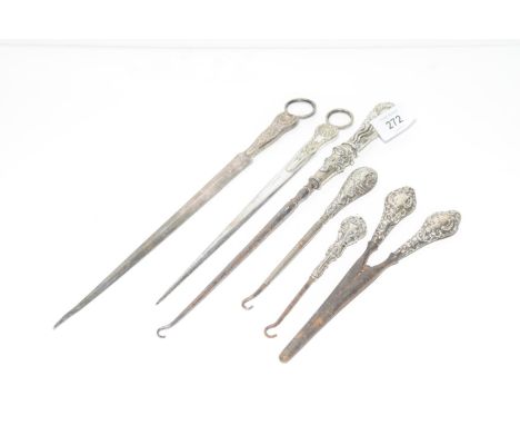 A group of silver and silver plated items Including various button hooks (one with London hallmark) glove stretchers, letter 