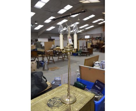 A brass table light The light with tri-form terminals, and slender stem to circular base, sold electrically untested. 