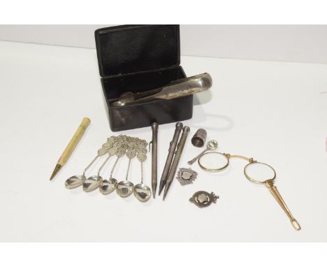 A collection of silver and white metal items to include three propelling pencils, Chinese white metal spoons, silver sugar to