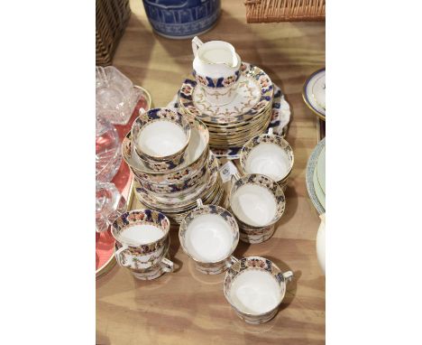 An Edwardian Japan pattern tea service Comprising of eleven tea cups and twelve saucers, sandwich platters, milk jug and suga