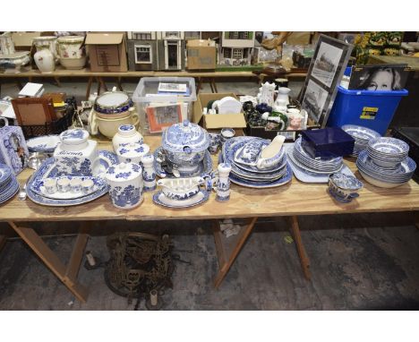 An extensive collection of Willow pattern ceramics Including large tureens, tea cups, various side plates, biscuit jars, napk