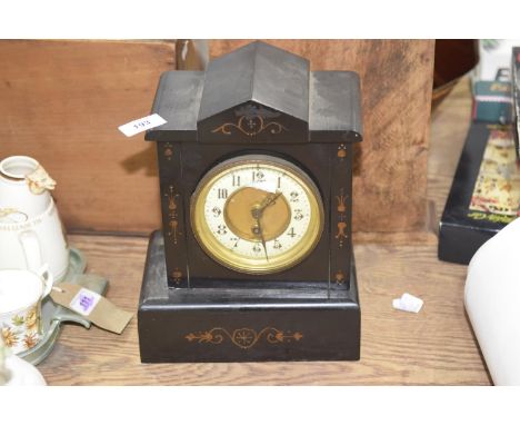 A slate mantel clock With cream enamel dial with Arabic numerals. 