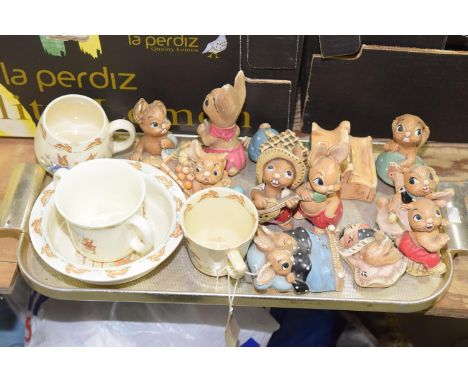 A collection of Pendelphin bunnykins figures Together with conforming three tea cups and bowl. 