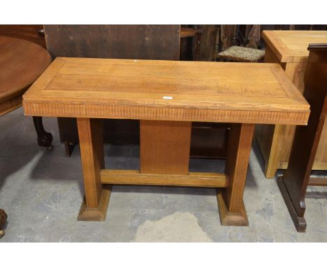 A 20th Century light oak alter table on twin trestle type supports. 