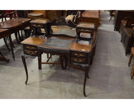 An early 20th Century mahogany ladies writing desk in the Chippendale styleWith a central shaped mirror above a sliding writi