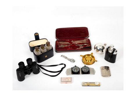 A pair of Bushnell binoculars, a hip flask, three spirit bottles and a quantity of sundries