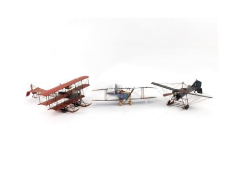 A Meccano model bi-plane and two other bi-planes