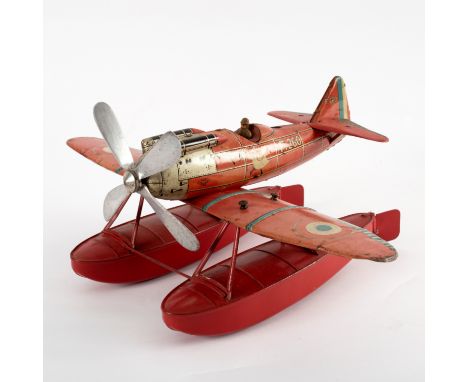 A tinplate model Unis Seaplane F.260, 14cm long CONDITION REPORT: The red floats are less faded than the main fuselage and wh