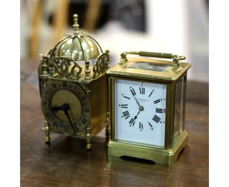 An eight-day carriage clock, Stewart Dawson and Co. Ltd., Regent St W, the gilt brass case with canted sides, the white ename