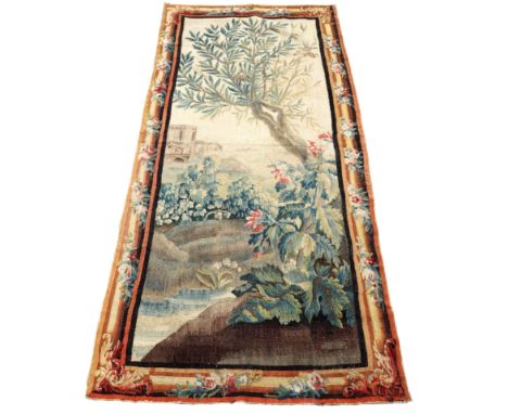 An early 18th Century Flemish tapestry, nesting birds in a tree with garden and church beyond, 270cm x 112cm/see illustration