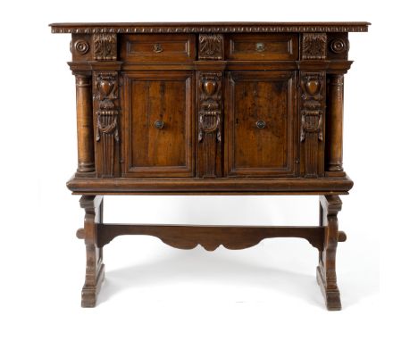 An Italian walnut cupboard on stand, drawers to frieze, early 18th Century, 140cm wide CONDITION REPORT: The cupboard has one