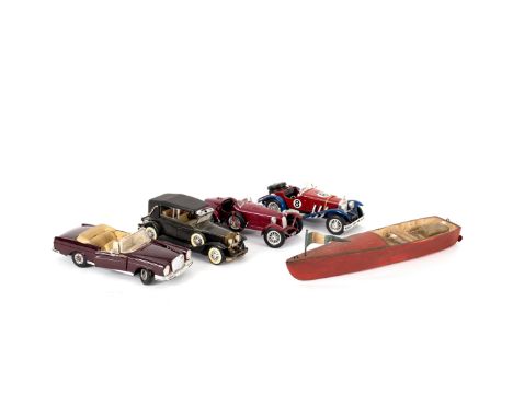 A Burago 1/18 scale diecast 3009 Mercedes Benz SSK 1928 car, three others and a wooden model boat/see illustration