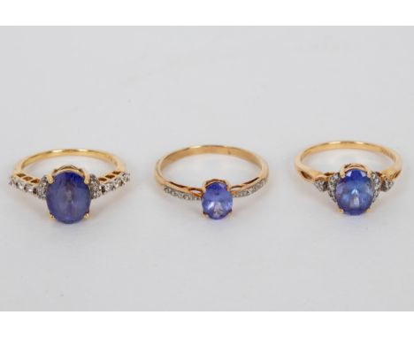 A tanzanite and diamond dress ring, the oval tanzanite flanked by diamond set shoulders to an 18ct yellow gold shank, size N,