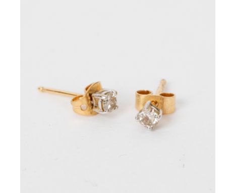 A pair of diamond ear studs, claw set to 18ct gold posts, the stones of approximately 0.10ct, a diamond set tie pin and a sti