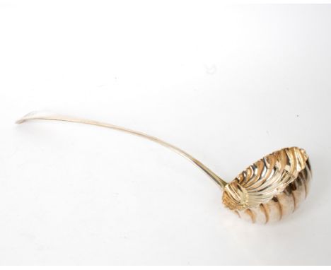 A George III silver ladle, London 1809, with shell bowl and crested terminal