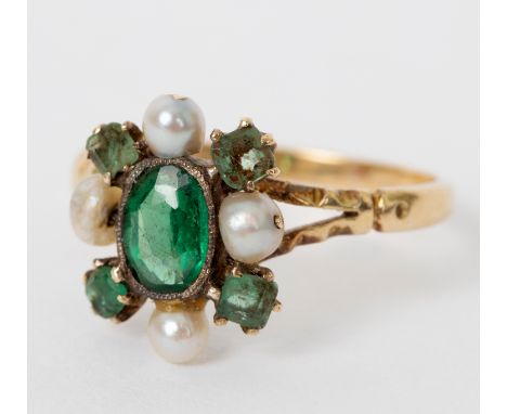 A Victorian emerald and pearl dress ring, the nine stone cluster to split shoulders and an unhallmarked yellow metal shank, s