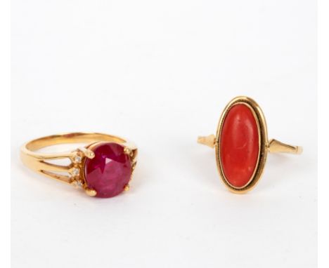 A ruby and diamond dress ring, the large oval ruby flanked by three small diamonds to each side and set in 18ct yellow gold, 