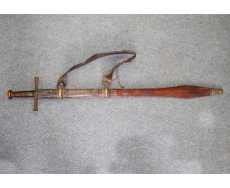 A Dervish sword used in the battle of Omdurman 2nd September 1898 bearing Khalija marks complete with strap and leather scabb