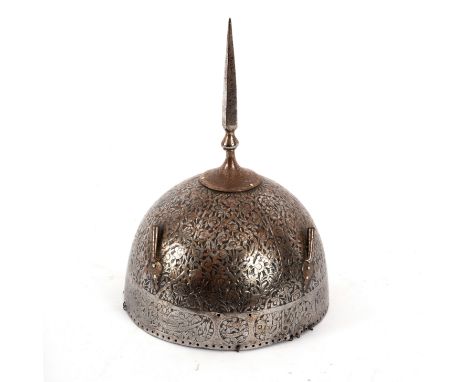 A Turkish helmet with incised foliate decoration and spiked finial, 29cm high