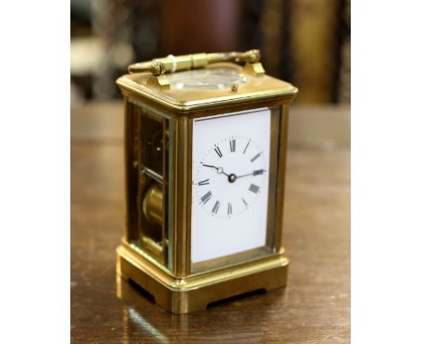 An eight-day hour repeat carriage clock, S J Retypoll patent, the gilt brass case with canted sides, the white enamel dial wi