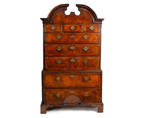 A walnut and herringbone banded chest on chest, 18th Century, the arched and moulded cornice above three short and five long 