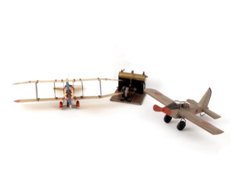 A Meccano model bi-plane, with pilot, another tinplate plane and a Mamod steam engine