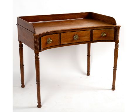 A Regency mahogany washstand with three-quarter galleried back, fitted three drawers to the frieze on ring-turned legs, 100cm