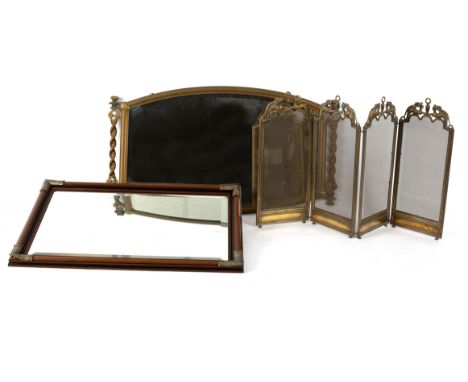 A brass framed overmantel with spiral column to the sides, 91.5cm wide, another mirror and a small folding firescreen