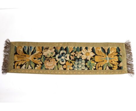 An 18th Century tapestry fragment, bound as a small table runner, 96cm x 27cm
