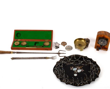 A carved balance scale, a mounted watch, a papier-maché tray, a bear ashtray, etc.