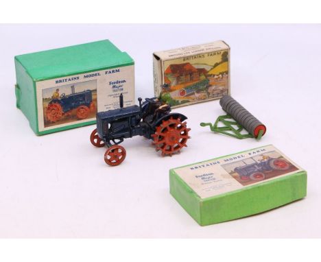 Britains: A boxed Britains, Fordson Major Tractor (Spudded Metal Wheels), No. 127F, blue body, red wheels; together with a bo