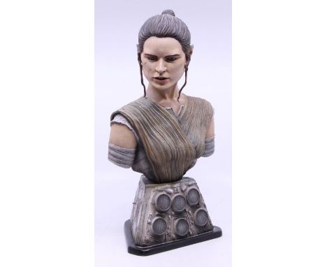 Star Wars: A high-quality model of Rey, Star Wars, upon base, resin cast, possibly by Nick Bradshaw, height approx. 34cm.