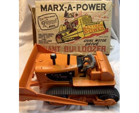 Marx: A boxed Marx Giant Bulldozer, battery operated in working condition. 1960’s. Some box damage. Please study pictures. (M