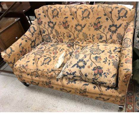 A circa 1900 upholstered two seat sofa, 133 cm wide x 70 cm deep x 79 cm high