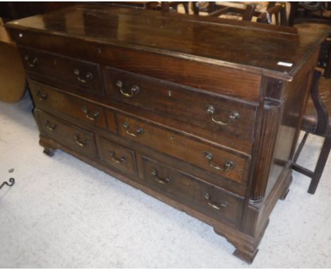 A 19th Century North Country oak and crossbanded mule chest with rising lid with two dummy drawers over a further long drawer