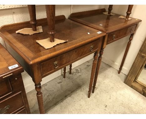 A pair of walnut lamp tables in the 18th Century style, the burr tops feather and cross banded within a moulded edge over sin